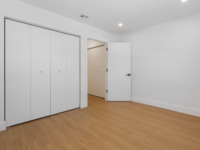 4524 Concordia Ln, Boynton Beach, FL 33436 - unfurnished bedroom featuring light wood-type flooring and recessed lighting