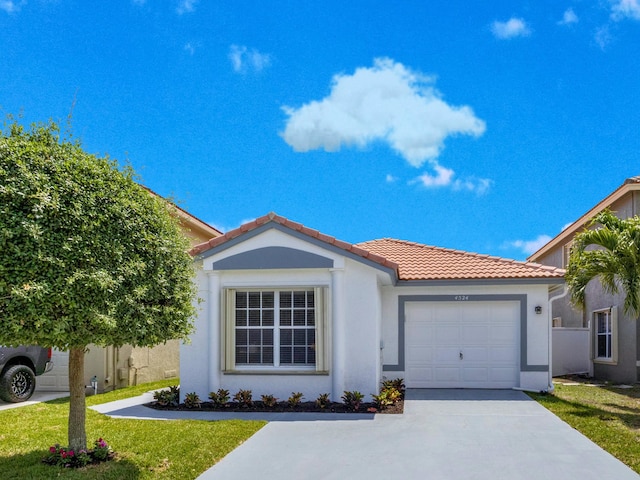 4524 Concordia Ln, Boynton Beach, FL 33436 - view of front of home with stucco siding, an attached garage, concrete driveway, a tile roof, and a front yard