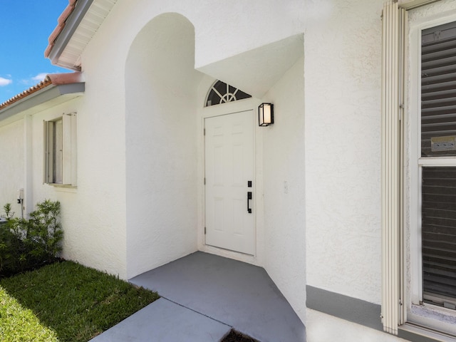 4524 Concordia Ln, Boynton Beach, FL 33436 - view of exterior entry featuring stucco siding