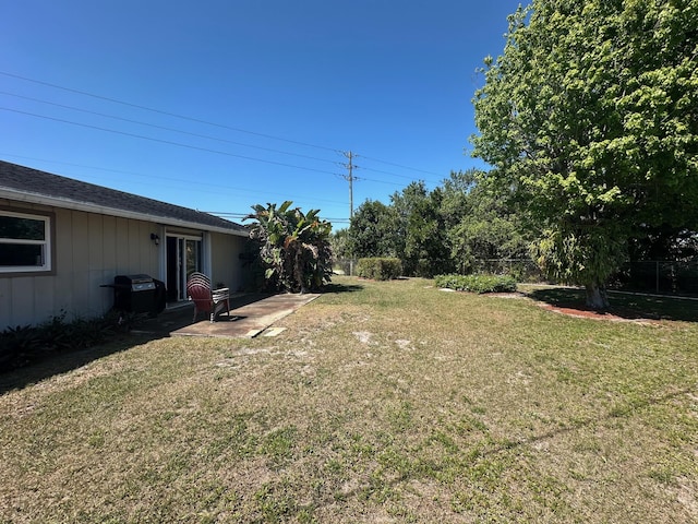 view of yard featuring a patio and fence