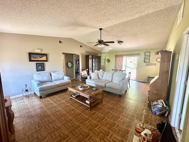 living room with visible vents, lofted ceiling, baseboards, and a ceiling fan