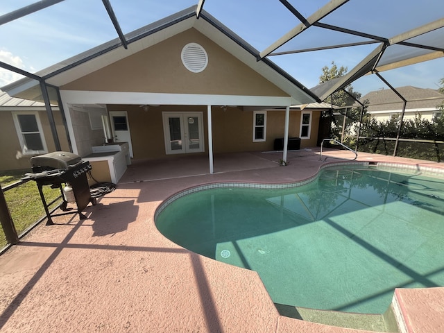 pool with glass enclosure, a patio, ceiling fan, french doors, and a grill