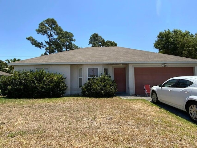 ranch-style home with stucco siding, a front lawn, and a garage