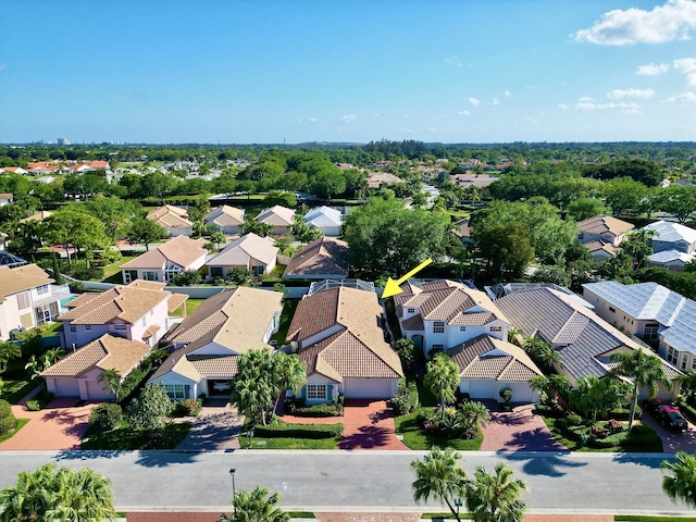 birds eye view of property with a residential view