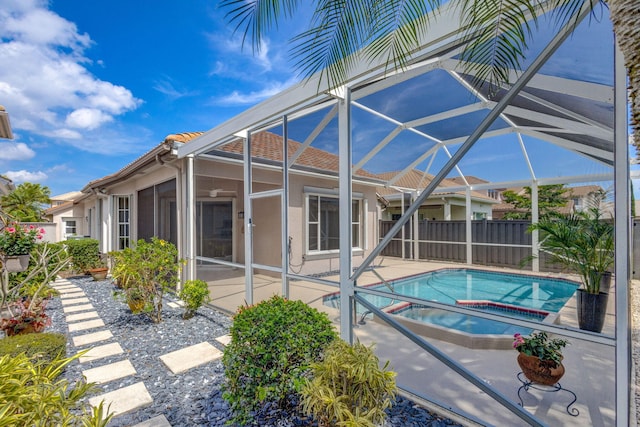 view of swimming pool featuring a lanai, a fenced in pool, a patio, and fence