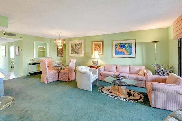 living area with a notable chandelier, carpet flooring, and visible vents