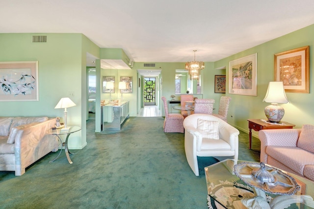 living room featuring an inviting chandelier, visible vents, and carpet floors