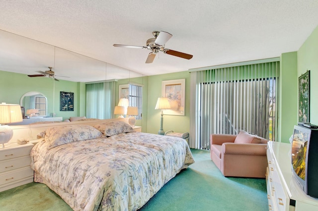 bedroom featuring light colored carpet, ceiling fan, and a textured ceiling