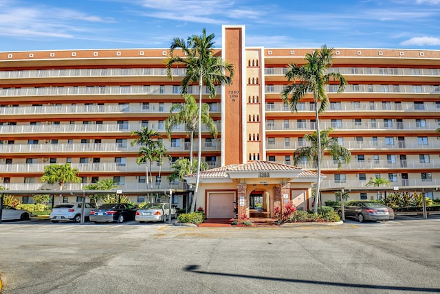 view of property with uncovered parking