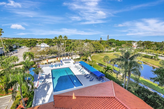 view of swimming pool with a water view