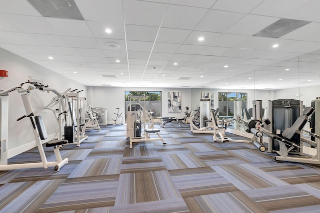 gym featuring recessed lighting, baseboards, and carpet