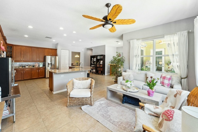 living room with light tile patterned floors, visible vents, recessed lighting, and ceiling fan