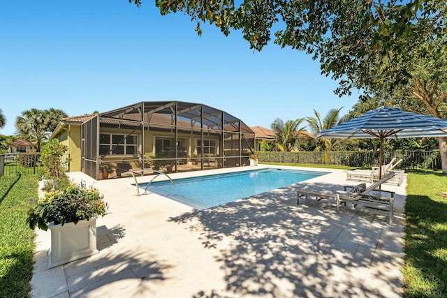 view of pool with a patio area, a fenced in pool, a lanai, and fence