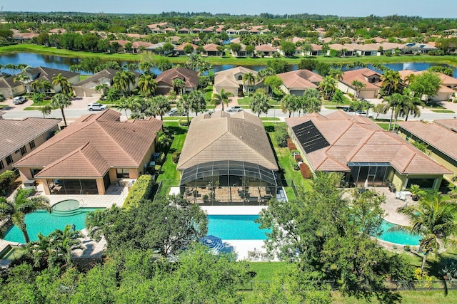 birds eye view of property featuring a residential view and a water view