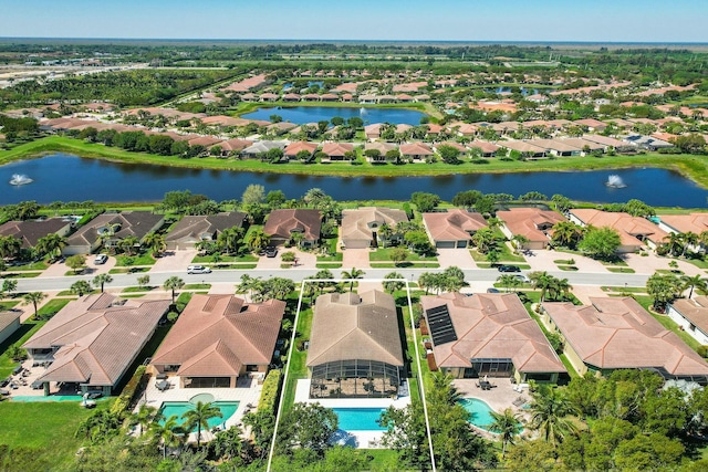 birds eye view of property featuring a residential view and a water view