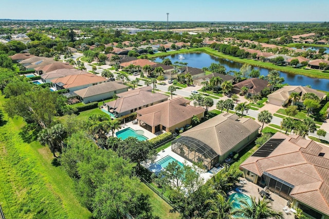 birds eye view of property with a residential view and a water view