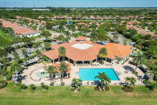 birds eye view of property with a residential view