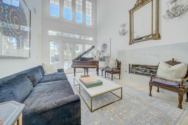 living room featuring a towering ceiling