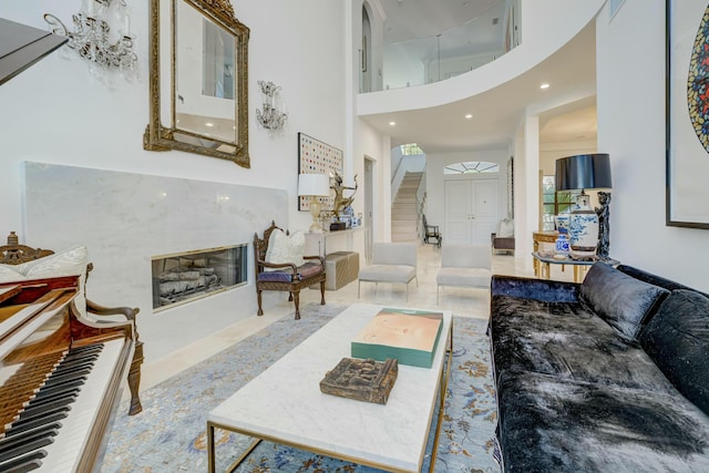 living room with a high ceiling and recessed lighting