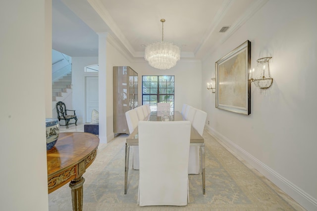 dining room with visible vents, baseboards, a chandelier, stairway, and ornamental molding