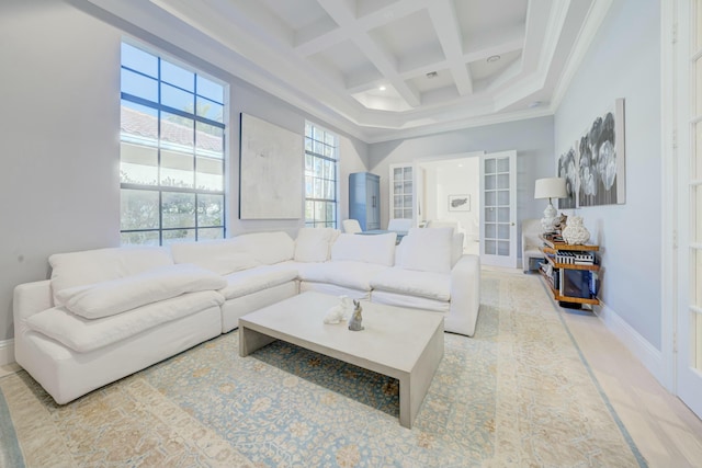 living room featuring baseboards, coffered ceiling, beam ceiling, light carpet, and crown molding