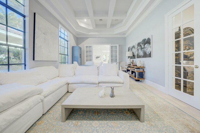 living area featuring baseboards, coffered ceiling, beam ceiling, recessed lighting, and crown molding