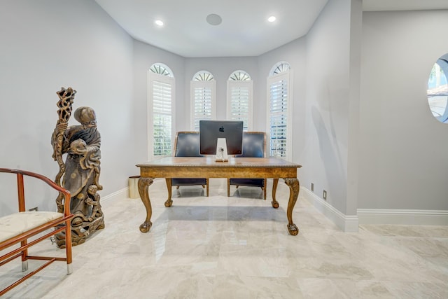 home office featuring recessed lighting, marble finish floor, and baseboards