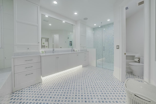 full bath with visible vents, toilet, a stall shower, recessed lighting, and vanity