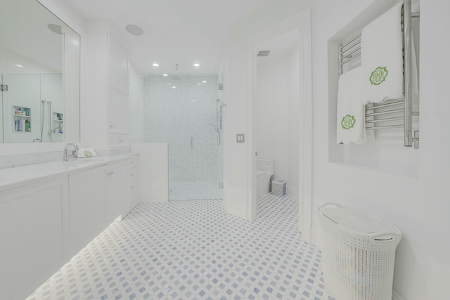 full bath featuring a marble finish shower, recessed lighting, toilet, and vanity