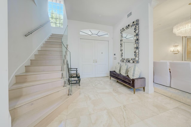 entryway with stairway and visible vents