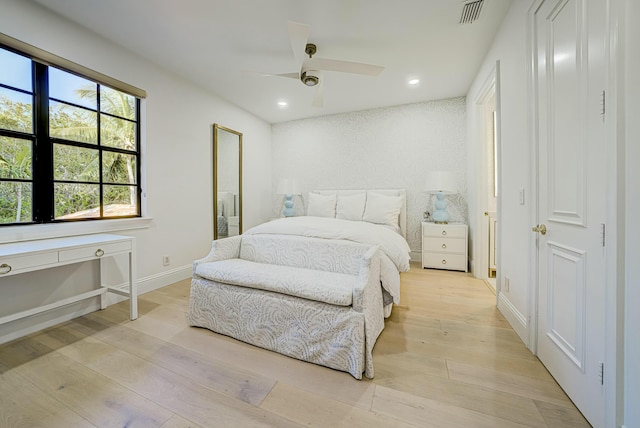 bedroom with light wood finished floors, visible vents, baseboards, ceiling fan, and recessed lighting