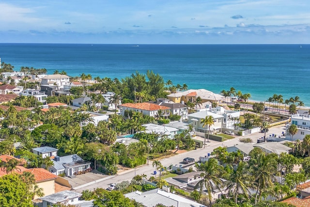 drone / aerial view featuring a water view and a residential view