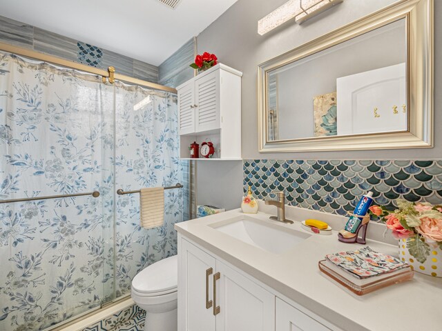 7882 Lake Sands Dr, Delray Beach, FL 33446 - bathroom featuring vanity, visible vents, a shower stall, toilet, and backsplash