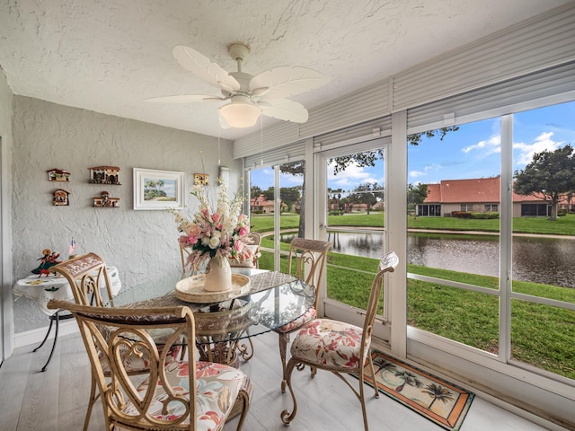 7882 Lake Sands Dr, Delray Beach, FL 33446 - sunroom / solarium with a wealth of natural light, a ceiling fan, and a water view