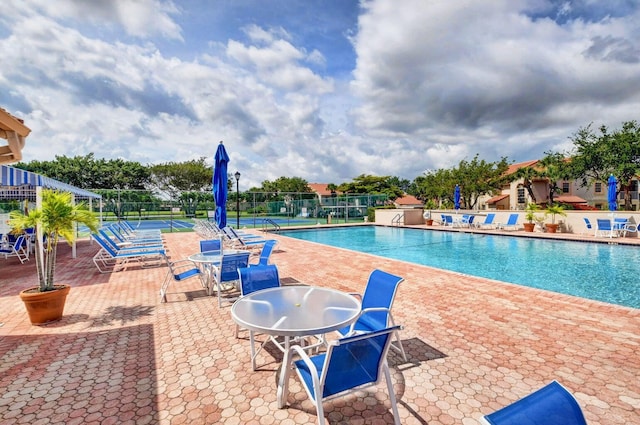 7882 Lake Sands Dr, Delray Beach, FL 33446 - community pool with a patio and fence
