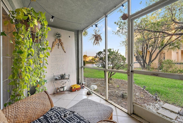 sunroom / solarium with a water view