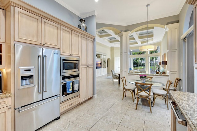 kitchen featuring beamed ceiling, coffered ceiling, stainless steel appliances, arched walkways, and decorative columns