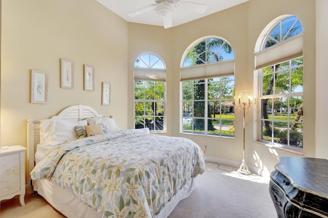 bedroom with multiple windows and carpet