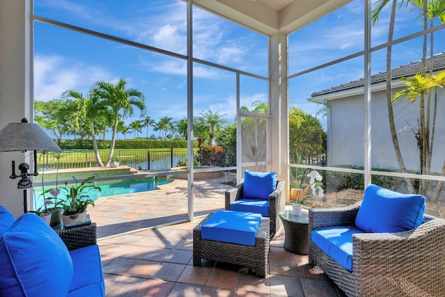 10255 Sand Cay Ln, West Palm Beach, FL 33412 - sunroom / solarium featuring a water view and an outdoor hangout area