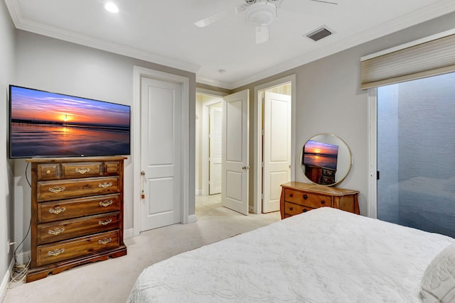 bedroom with visible vents, ornamental molding, baseboards, light colored carpet, and ceiling fan