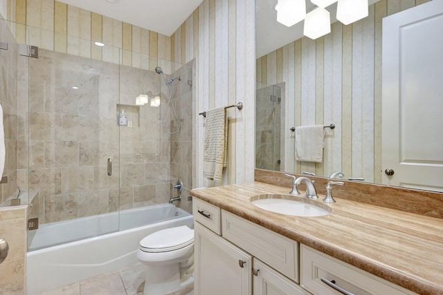 bathroom with wallpapered walls, toilet, bathtub / shower combination, tile patterned floors, and vanity