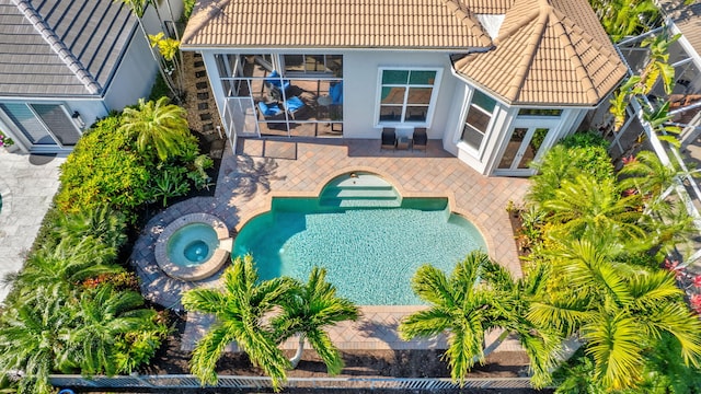 10255 Sand Cay Ln, West Palm Beach, FL 33412 - view of pool featuring a patio area, french doors, and a pool with connected hot tub