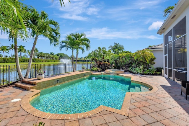 view of swimming pool featuring glass enclosure, a patio, a water view, and a pool with connected hot tub