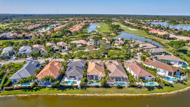 drone / aerial view featuring a residential view and a water view