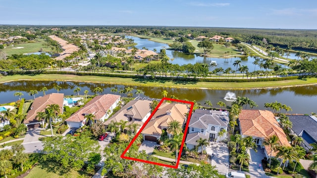 bird's eye view featuring a water view and a residential view