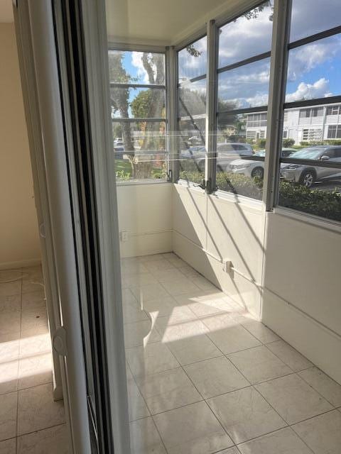 unfurnished sunroom with plenty of natural light