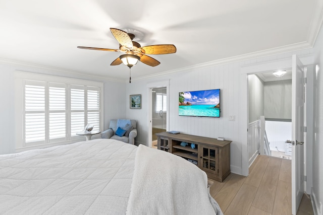 bedroom with crown molding, a ceiling fan, and light wood-style floors