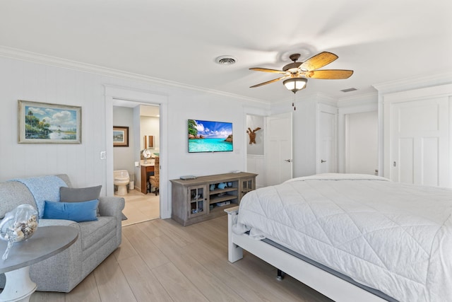 bedroom featuring ornamental molding, visible vents, and light wood finished floors