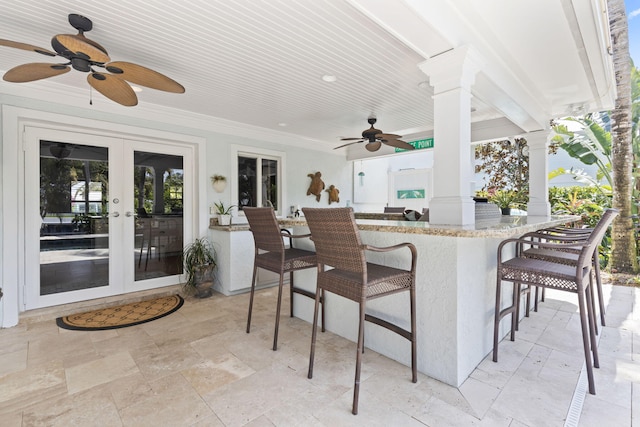 view of patio with french doors, ceiling fan, and outdoor wet bar