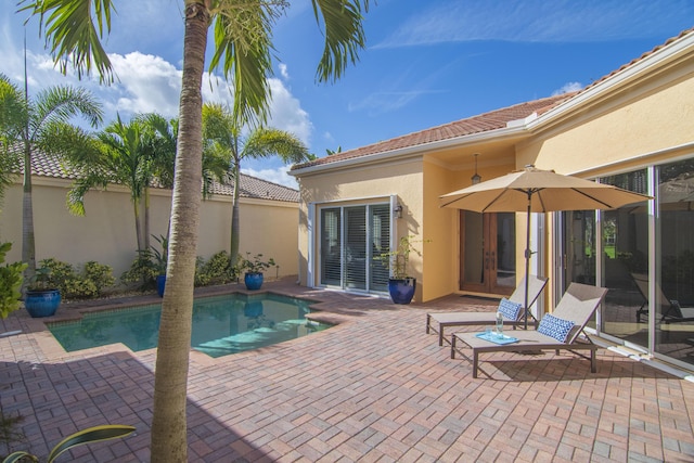 9555 E Maiden Ct, Vero Beach, FL 32963 - swimming pool featuring a patio area and french doors